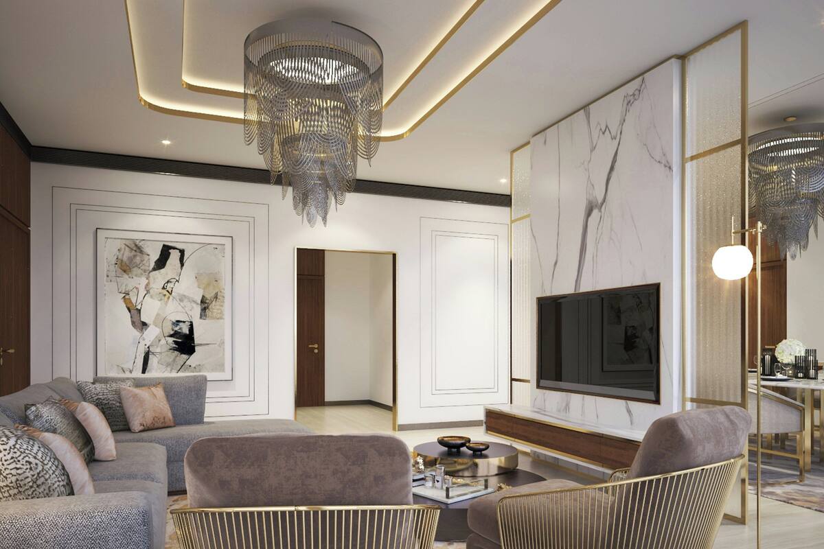 A modern living room with a sofa, armchairs, a coffee table, a TV, and a chandelier.