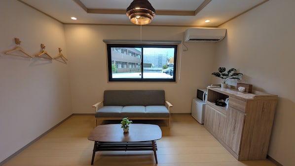 Suite Supérieure, vue jardin | Salle de séjour