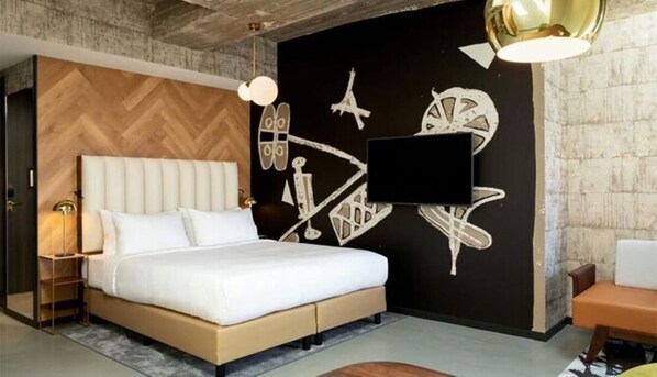 A modern bedroom with a large bed, a TV mounted on the wall, and a unique cityscape mural. - Modern Comfort in Rotterdam Near Shops, Nightlife & Cultural Sights (Rotterdam)