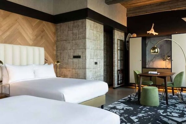Settle in with flexible sleeping space and modern industrial style.