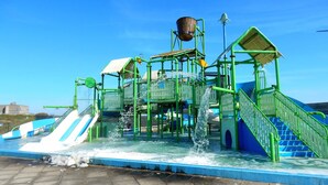 A water play area with multiple slides and water jets. - Relaxing Haamstede Haven | beach escape, Scenic Nature trails, Local attractions (Burgh-Haamstede)