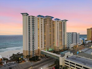 A high-rise hotel with multiple balconies and a view of the ocean. - Aqua 2310 PCB at its Finest/Oceanfront/ High Clean Standard/Wifi (Panama City Beach)