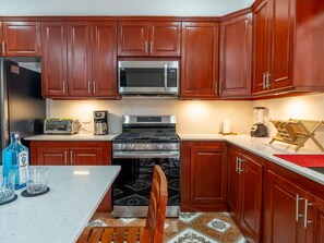 Fridge, microwave, oven, cookware/dishes/utensils