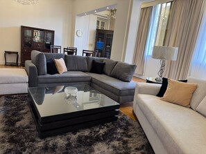 Living area - "Classic Style apart". by Interhome (Abu Al Feda)