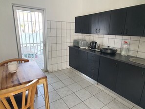 Fridge, microwave, cookware/dishes/utensils