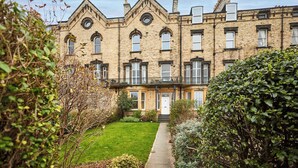 A traditional brick building with a symmetrical facade, multiple windows, and a central entrance. - Host and Stay | Balmoral Terrace (Saltburn-by-the-Sea)