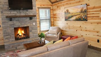Comfort Cabin, 2 Bedrooms, Non Smoking, Pets allowed | Living room | 50-inch Smart TV with digital channels, fireplace