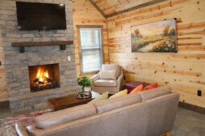 Comfort Cabin, 2 Bedrooms, Non Smoking, Pets Allowed | Living room | 50-inch Smart TV with digital channels, fireplace - The Scarlet Pines (Broken Bow)