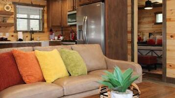 Comfort Cabin, 2 Bedrooms, Non Smoking, Pets allowed | Living room | 50-inch Smart TV with digital channels, fireplace