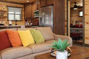 Comfort Cabin, 2 Bedrooms, Non Smoking, Pets Allowed | Living room | 50-inch Smart TV with digital channels, fireplace - The Scarlet Pines (Broken Bow)