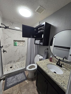 Shower, hair dryer, towels, soap