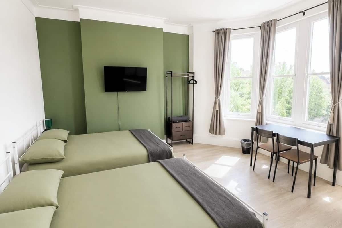 Family Quadruple Room | Desk, laptop workspace, iron/ironing board, free WiFi