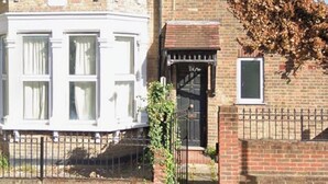 A two-story house with a brick facade and a white corner section. - KW SELF CONTAIN STUDIOS ALEXANDRA PALACE (London)
