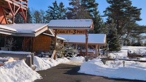 A wooden chalet with a sign reading 'CHALET des 3 PINS' in a snowy outdoor setting. - Guest Room 'Chalet Des 3 Pins - Vitamines' with Mountain View, Shared Terrace & Wi-Fi (Plaine)