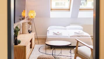 Apartamento, 1 cama Queen e sofá-cama, cozinha, vista para a cidade | Cortinas blackout, ferros/tábuas de passar roupa, Wi-Fi de cortesia