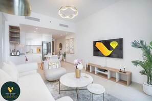 Luxury Apartment, Balcony, City View | Living area | 55-inch Smart TV with cable channels - Vogue | Downtown with Direct Access to Dubai Mall (Dubai)