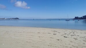 A beach with a clear sky, calm water, and boats. - 50m beach balcony facing the sea 2P duplex 31 m2 for 2 adults + 2 children, (LOCQUIREC)