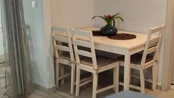 Quadruple Room, Balcony, Courtyard View | Dining