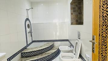 Shower, bidet, towels, soap