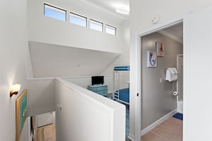 A bedroom with a bunk bed, a desk, and a window. - Pet-Friendly 2BR | Walk to the Beach | Pool (Panama City Beach)