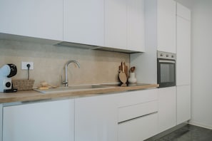 Family Apartment, 1 Double Bed with Sofa bed, Kitchenette, Courtyard View | Private kitchen - Gaiè Apartments (Carbonia)