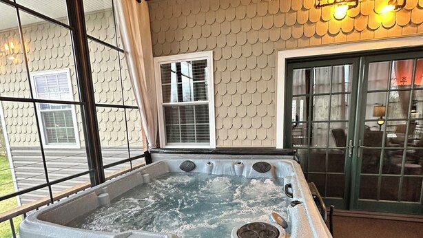 A hot tub with a bench, large windows, and a wooden ceiling. - All Aboard for a stay you wont forget. Trestle View, get your tickets now. (Shenandoah)