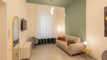 Habitación doble Deluxe, 1 habitación, para no fumadores | Área de sala de estar