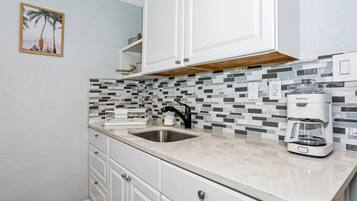 Fridge, microwave, stovetop, coffee/tea maker