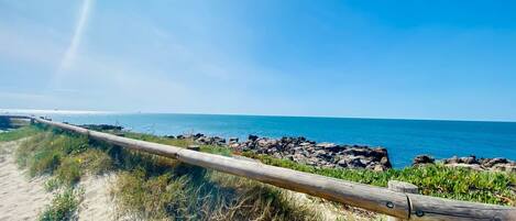 On the beach, sun loungers, beach towels