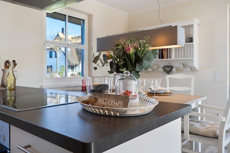 Dining. Holiday Home 'Idyllisches Reethaus in Strandnähe' with Shared Terrace, Private Garden and Wi-Fi
