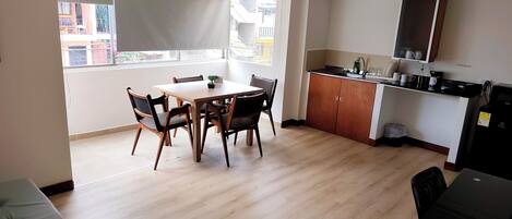 Basic Triple Room, Multiple Beds, Kitchenette | Dining