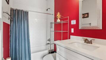 Shower, hair dryer, towels, shampoo