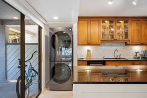 A modern kitchen with wooden cabinets, a stainless steel refrigerator, and a built-in oven. - 2BR Hilton Head Villa | 3 Pools + Bike to Coligny in 5 Min (Hilton Head Island)