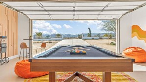 A pool table with a view of mountains and a clear sky. - The Golden Hour Mirage|Hot Tub|Game Room|Near Park (Joshua Tree)