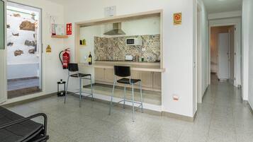 Fridge, microwave, stovetop, coffee/tea maker