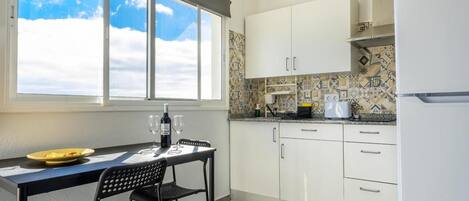 Fridge, microwave, stovetop, coffee/tea maker