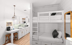 A compact, modern room with a kitchenette, a bunk bed, and a dining area. - The Inn at Seacrest Beach Unit 207 (Alys Beach)