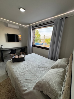 Deluxe Suite, City View | Hypo-allergenic bedding available, desk, laptop workspace