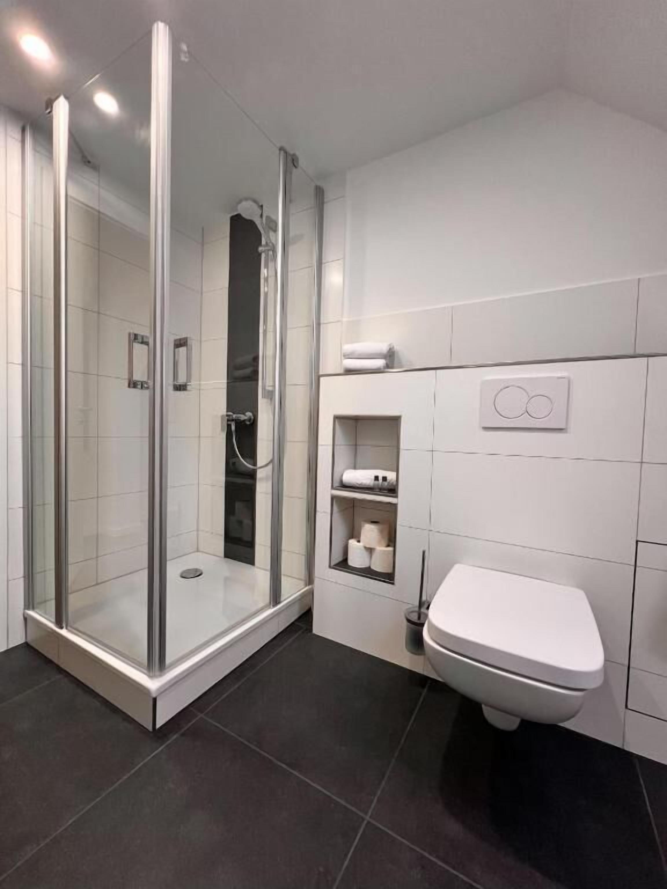 Comfort Double Room, Courtyard View | Bathroom | Shower, hair dryer, towels, soap