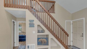 A staircase with wooden railings leading to an upper floor.