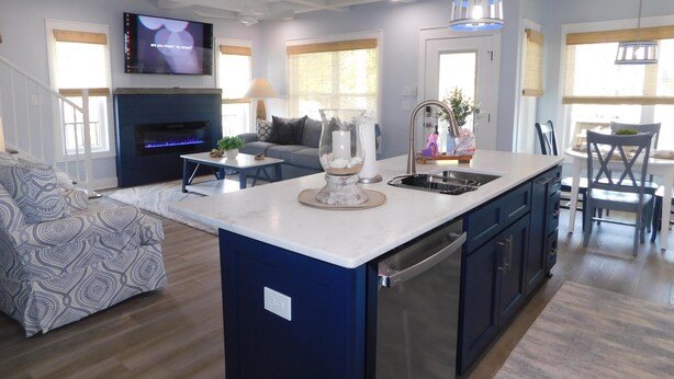 A modern kitchen with a central island, built-in appliances, and pendant lighting. - 1009 Stunning 4Bed 4.5 Bath | Lake & Ocean Views (Myrtle Beach)