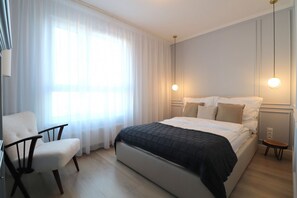 Deluxe appartement, balkon | Een strijkplank/strijkijzer, gratis wifi