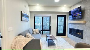 Living area - 3 Sisters Mountain Getaway | Luxe 2BR w Pool & Gym (Canmore)