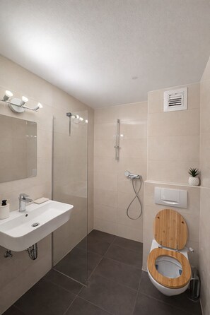 Shower, towels, soap, toilet paper