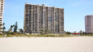 A high-rise hotel with multiple floors, a flat roof, and a beachside location. - Waterfront Resort Gulf View | Pool & Beach Access (Clearwater)