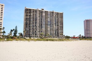 A high-rise hotel with multiple floors, a flat roof, and a beachside location. - Waterfront Resort Gulf View | Pool & Beach Access (Clearwater)
