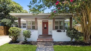 A house with a covered porch, a front door, and a pathway leading to the entrance. - Beach Bungalow w/ Pool & Hot Tub. Casinos nearby! (Biloxi)
