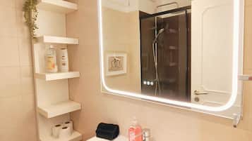 Shower, hair dryer, towels, soap