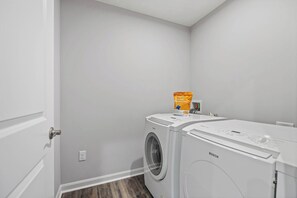 A laundry room with a Bosch washing machine and a bag of detergent. - New 5BR Home Ark + Creation Museum Sleeps 10 (Walton)
