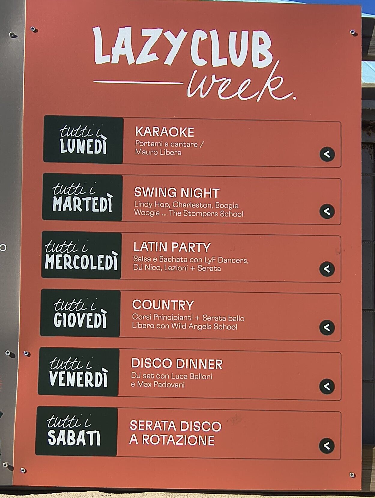 A schedule board for LAZY CLUB week with events listed for each day of the week.
